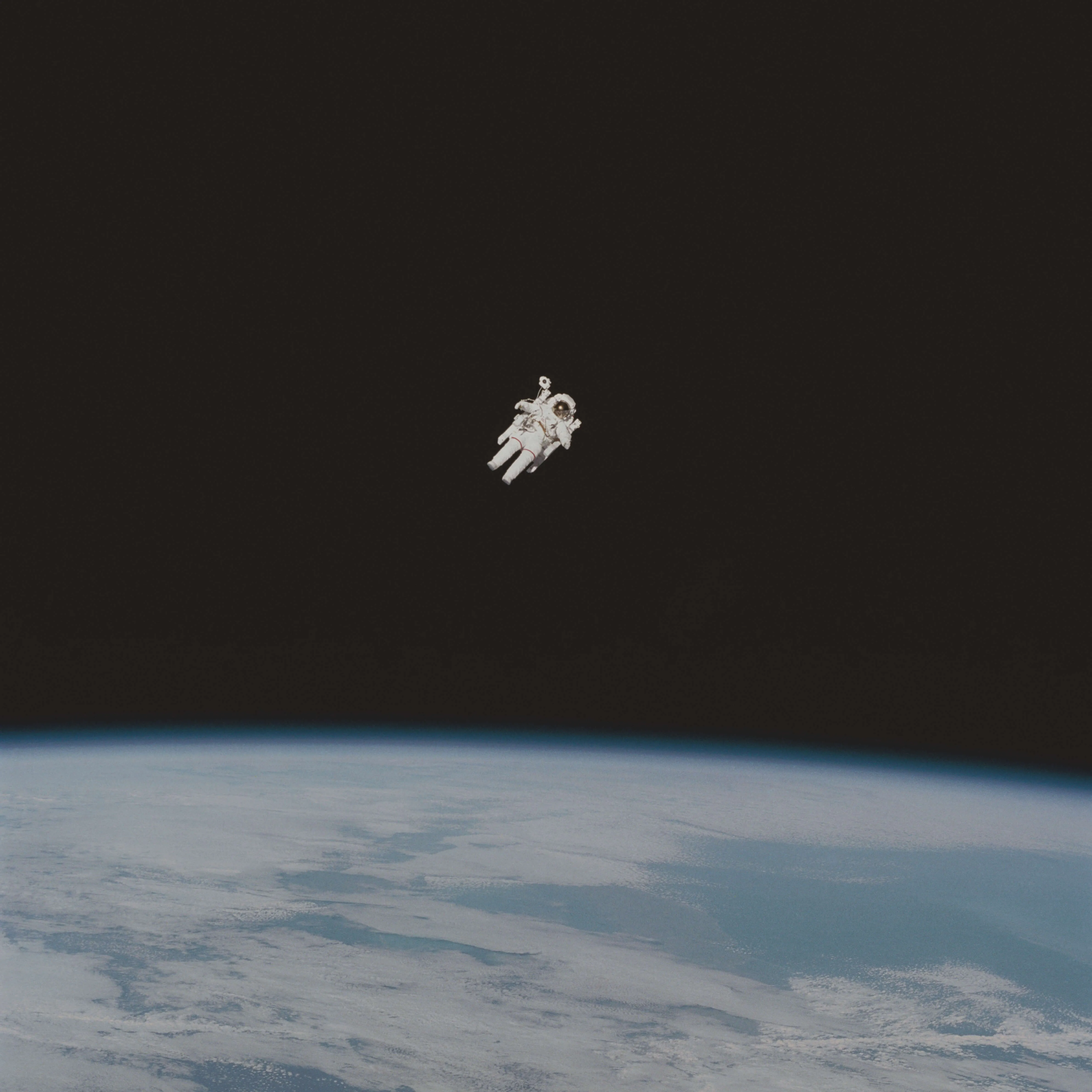 Astronaut floating in space above Earth, representing the rare few exceptional individuals who achieve what seems impossible and operate at the highest levels of human capability